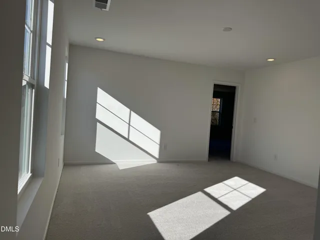 a kitchen with white cabinets appliances and sink