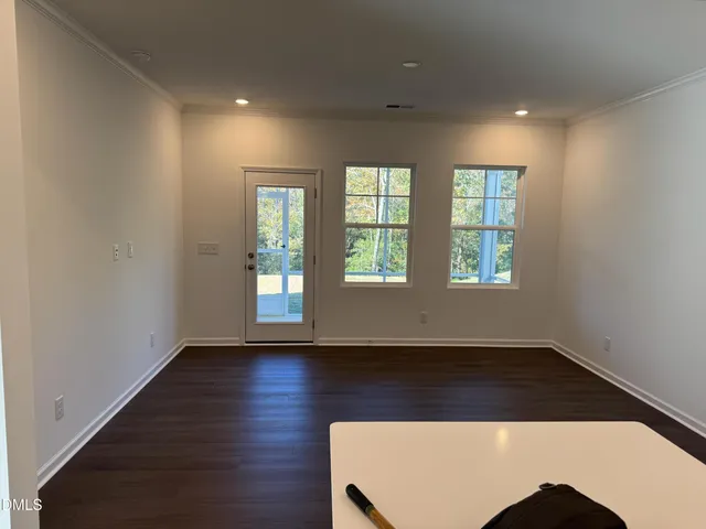 a kitchen with kitchen island a sink stainless steel appliances and cabinets