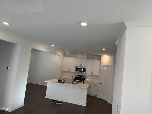 a room with furniture and wooden floor