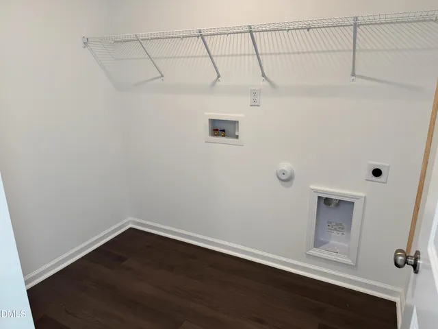 a view of a small space with wooden floor