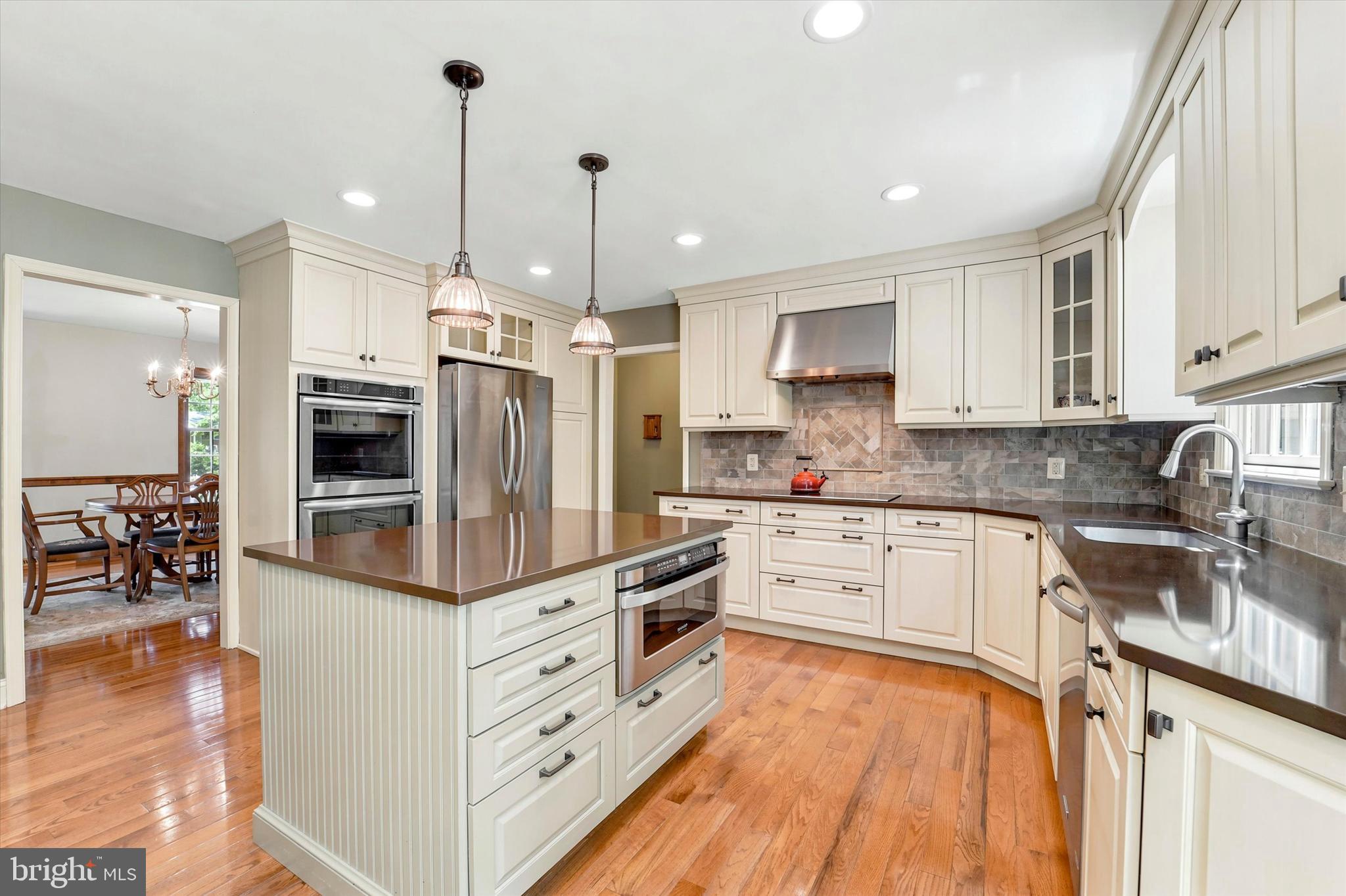 1980 Terwood Road Huntingdon Valley, PA 19006 - Photo 5 of 48 a kitchen with stainless steel appliances kitchen island granite countertop a stove a sink and a refrigerator
