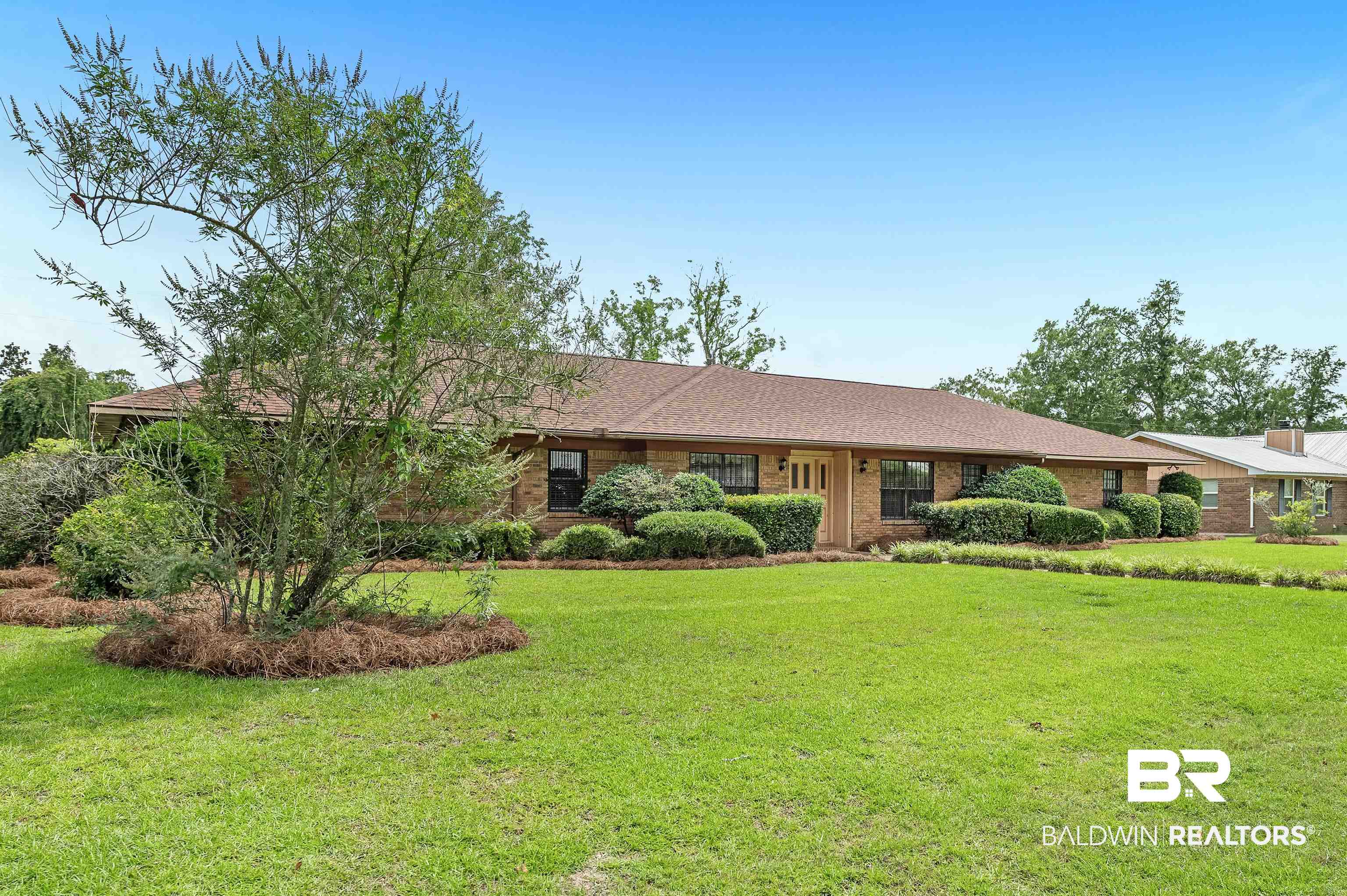 610 East Walker Avenue Foley, AL 36535 - Photo 3 of 38 Ranch-style home with a front yard and brick siding