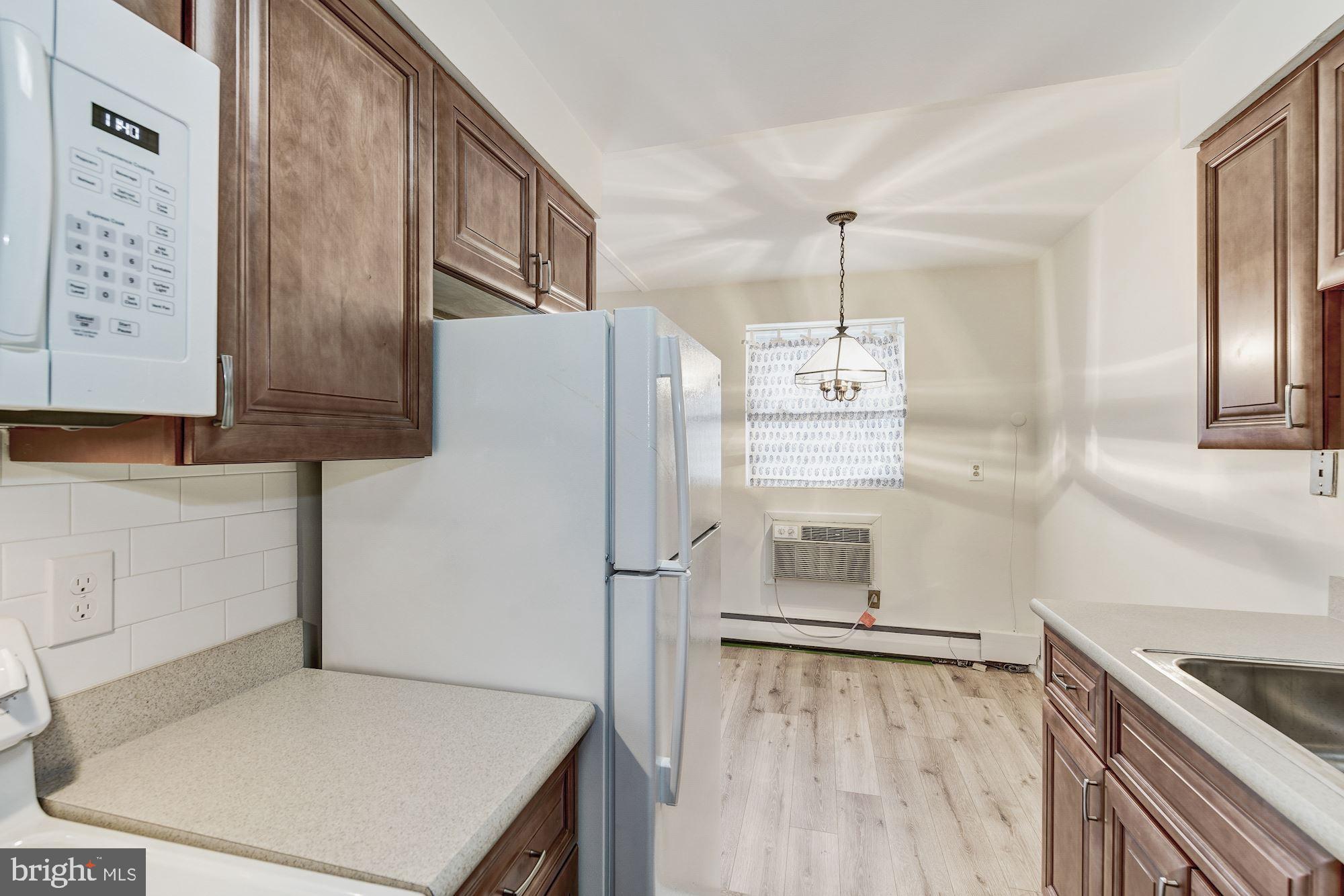 412 North Wayne Avenue, Unit 107 Wayne, PA 19087 - Photo 8 of 20 Kitchen looking into the dining room