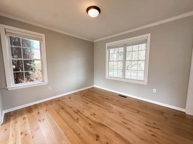 a kitchen with stainless steel appliances granite countertop wooden cabinets a sink and dishwasher next to a window