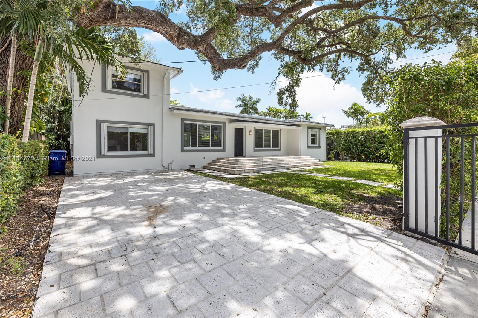 135 Southwest 22nd Road Miami, FL 33129 - Photo 4 of 44 a front view of a house with yard porch and seating space