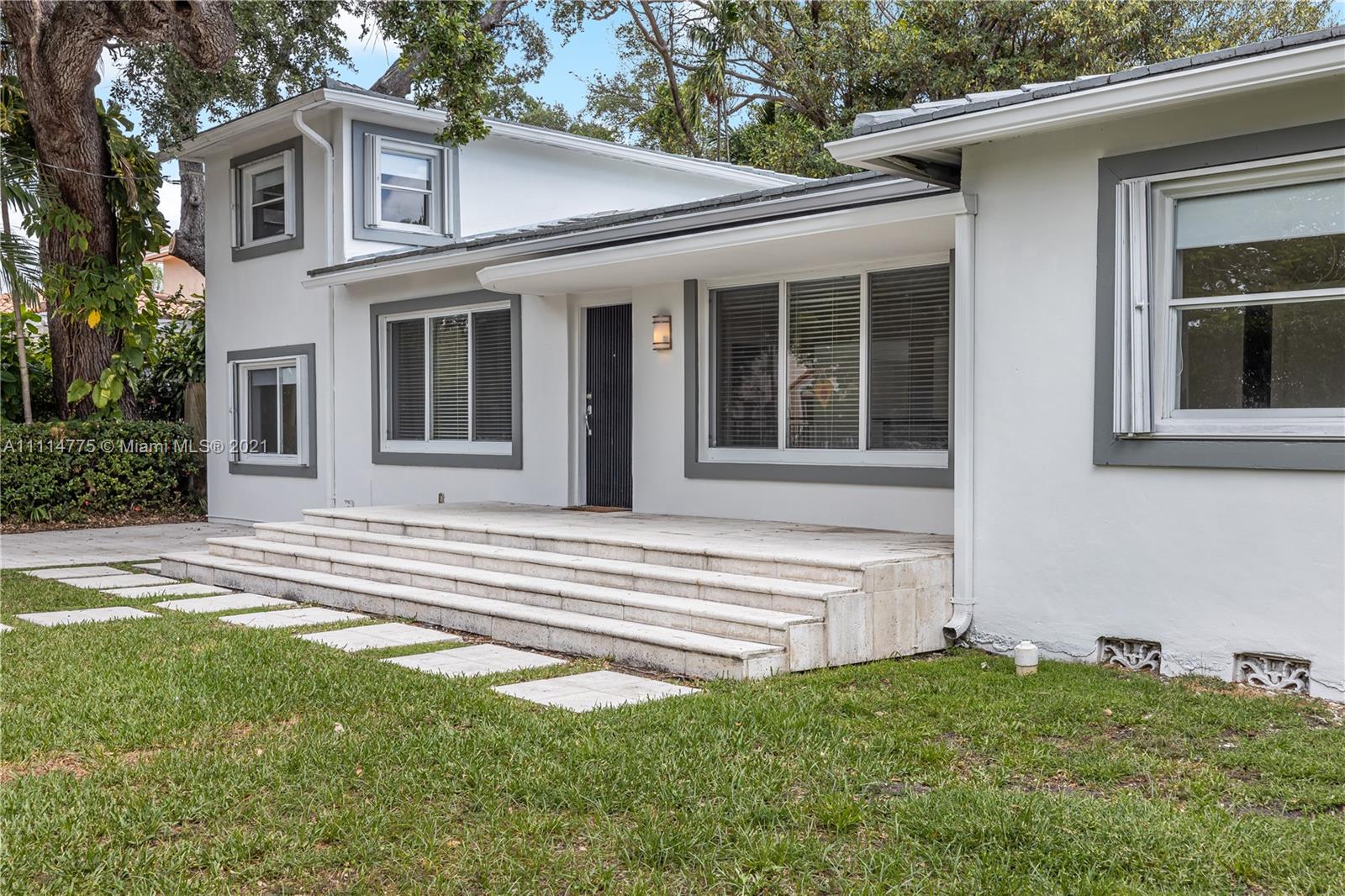 135 Southwest 22nd Road Miami, FL 33129 - Photo 8 of 44 a view of a house with a yard and sitting area