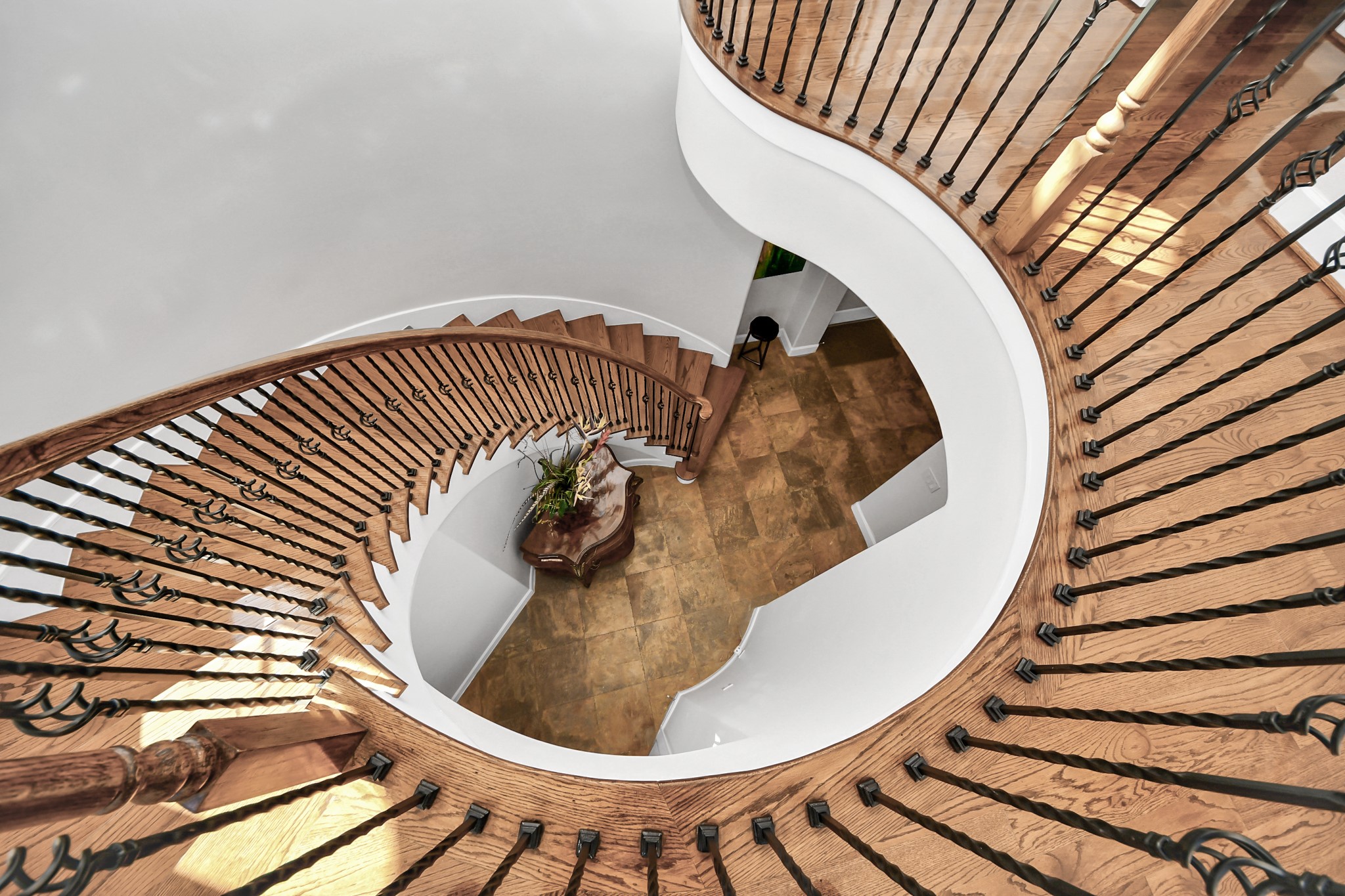 6302 Hermann Lake Drive Houston, TX 77021 - Photo 23 of 50 The second floor reveals a stunning architectural moment as the graceful staircase curves around the dramatic rotunda below.