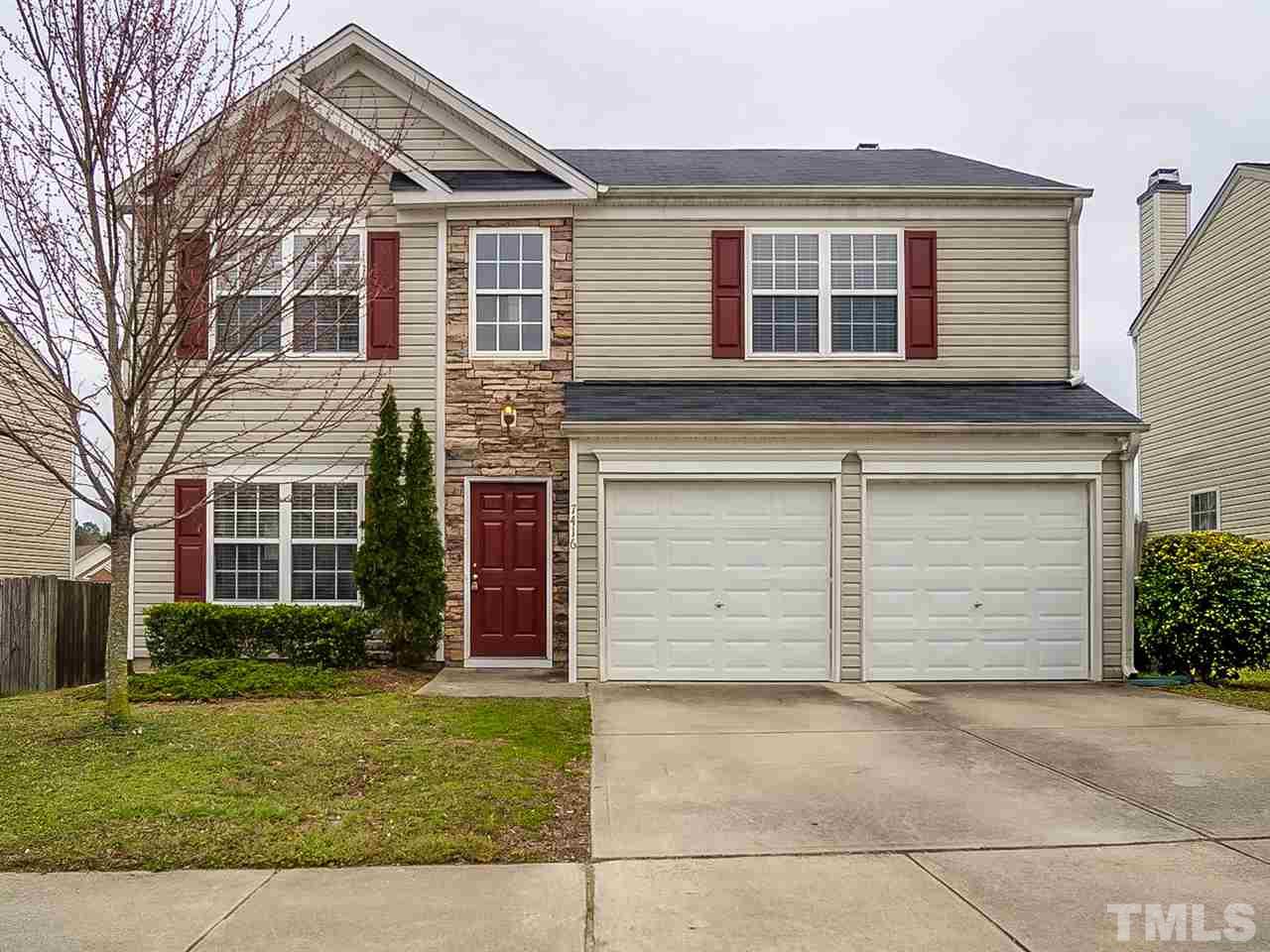 7416 Lowell Ridge Road Raleigh, NC 27616 - Photo 1 of 26 front view of a house and a yard