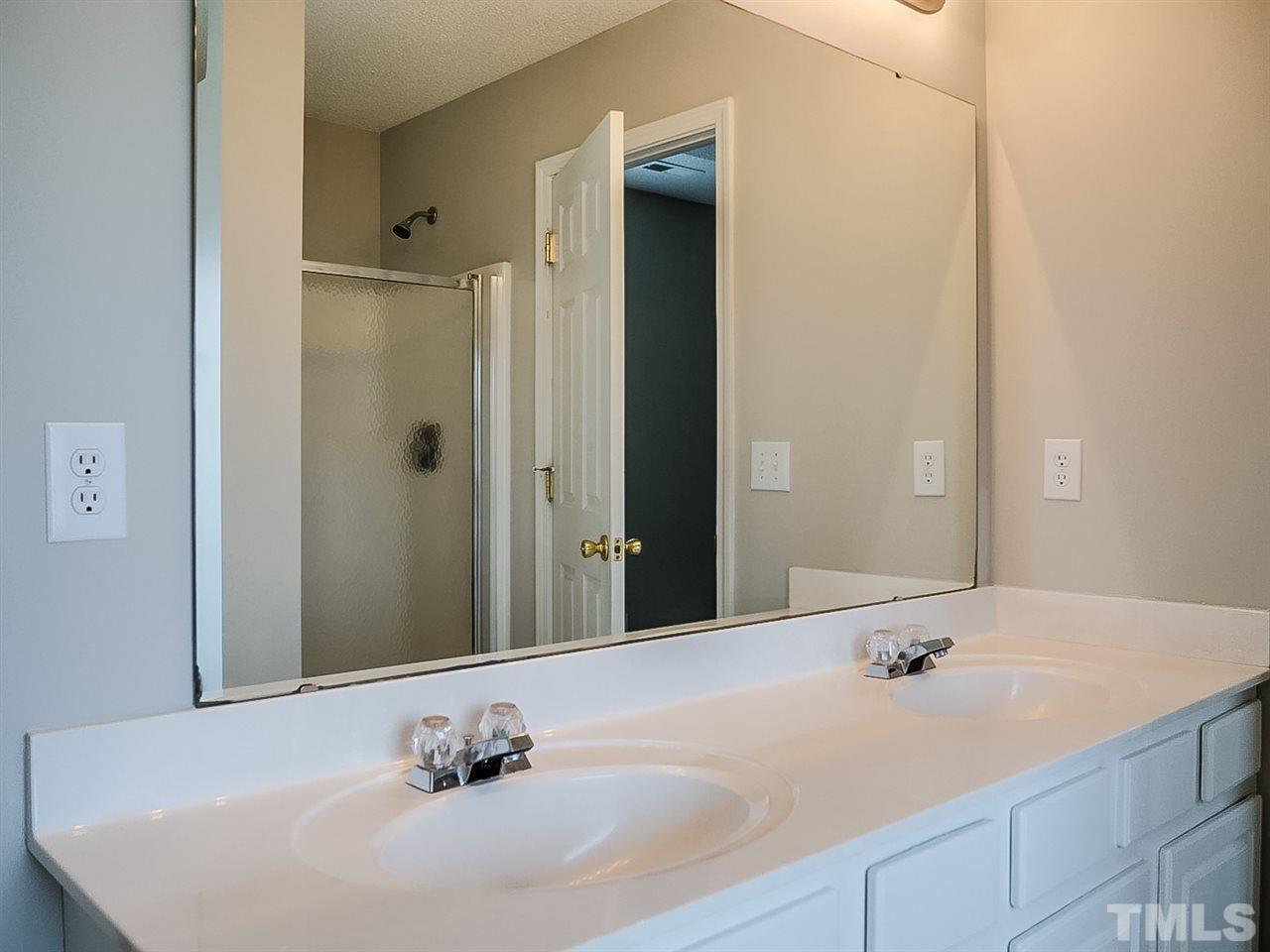 7416 Lowell Ridge Road Raleigh, NC 27616 - Photo 13 of 26 a bathroom with a sink and a mirror