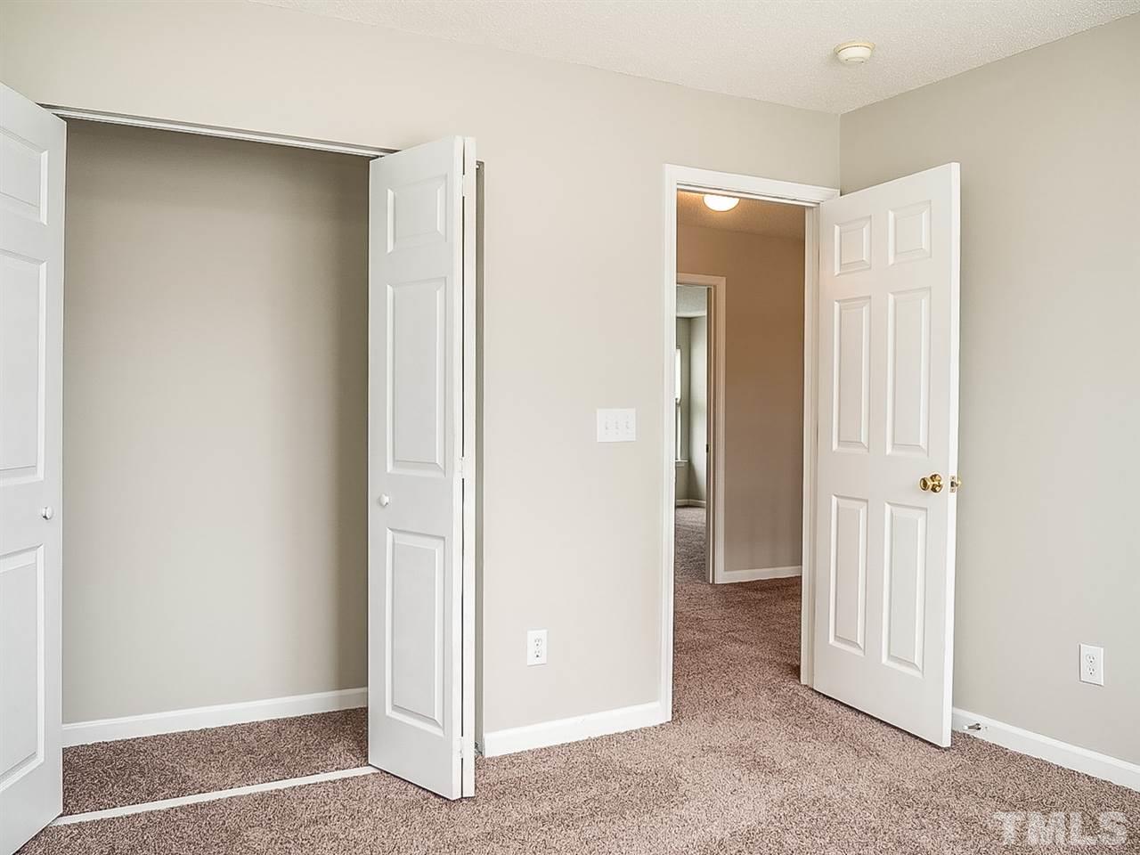 7416 Lowell Ridge Road Raleigh, NC 27616 - Photo 18 of 26 an empty room with closet and a bathroom