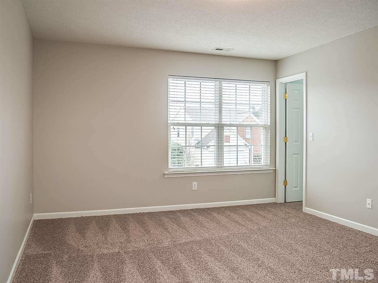 7416 Lowell Ridge Road Raleigh, NC 27616 - Photo 19 of 26 a view of an empty room with a window