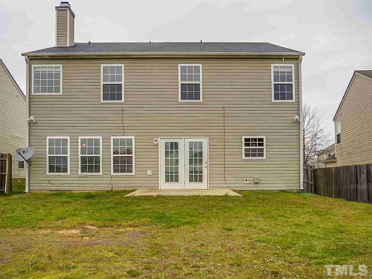 7416 Lowell Ridge Road Raleigh, NC 27616 - Photo 23 of 26 a front view of a house with a garden