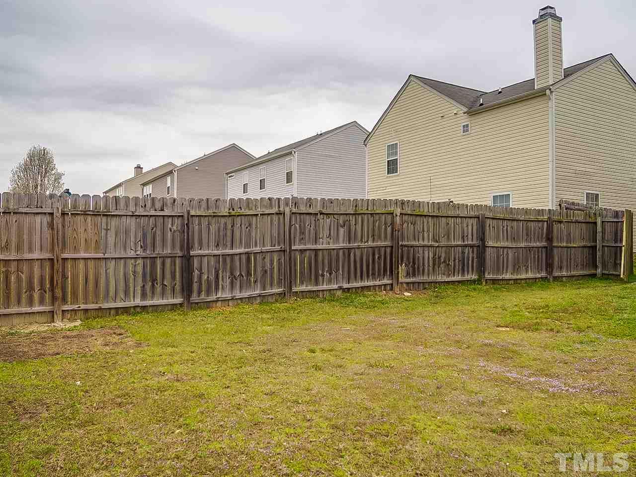 7416 Lowell Ridge Road Raleigh, NC 27616 - Photo 25 of 26 a view of a backyard with a small pool