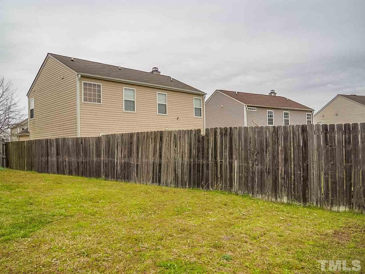 7416 Lowell Ridge Road Raleigh, NC 27616 - Photo 26 of 26 a view of swimming pool with wooden fence