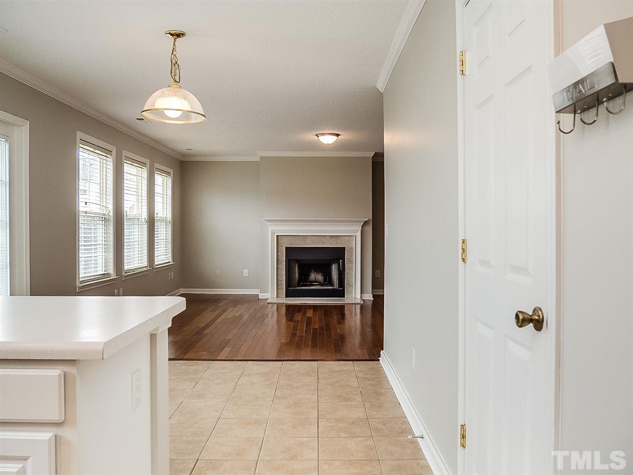 7416 Lowell Ridge Road Raleigh, NC 27616 - Photo 4 of 26 a view of an empty room with a fireplace and a window