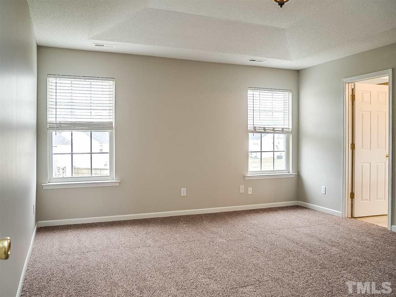 7416 Lowell Ridge Road Raleigh, NC 27616 - Photo 8 of 26 an empty room with windows