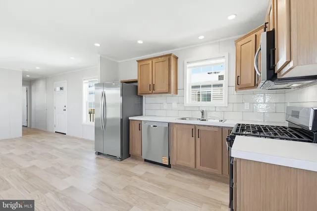 a kitchen with a refrigerator and a sink