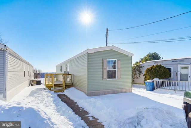a front view of a house with backyard
