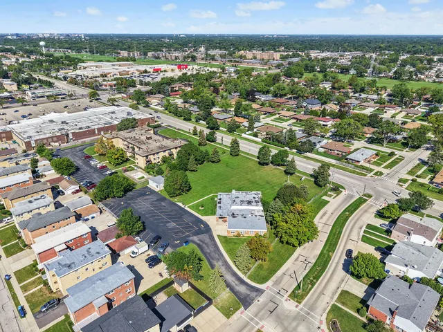 an aerial view of residential houses with outdoor space