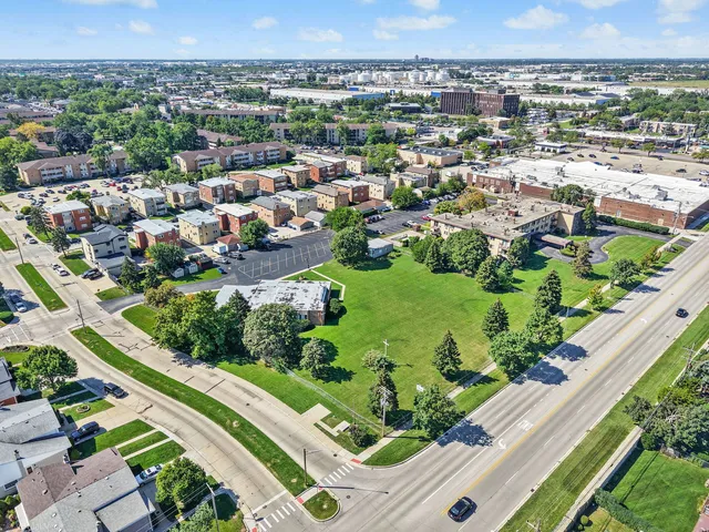 an aerial view of residential houses with outdoor space
