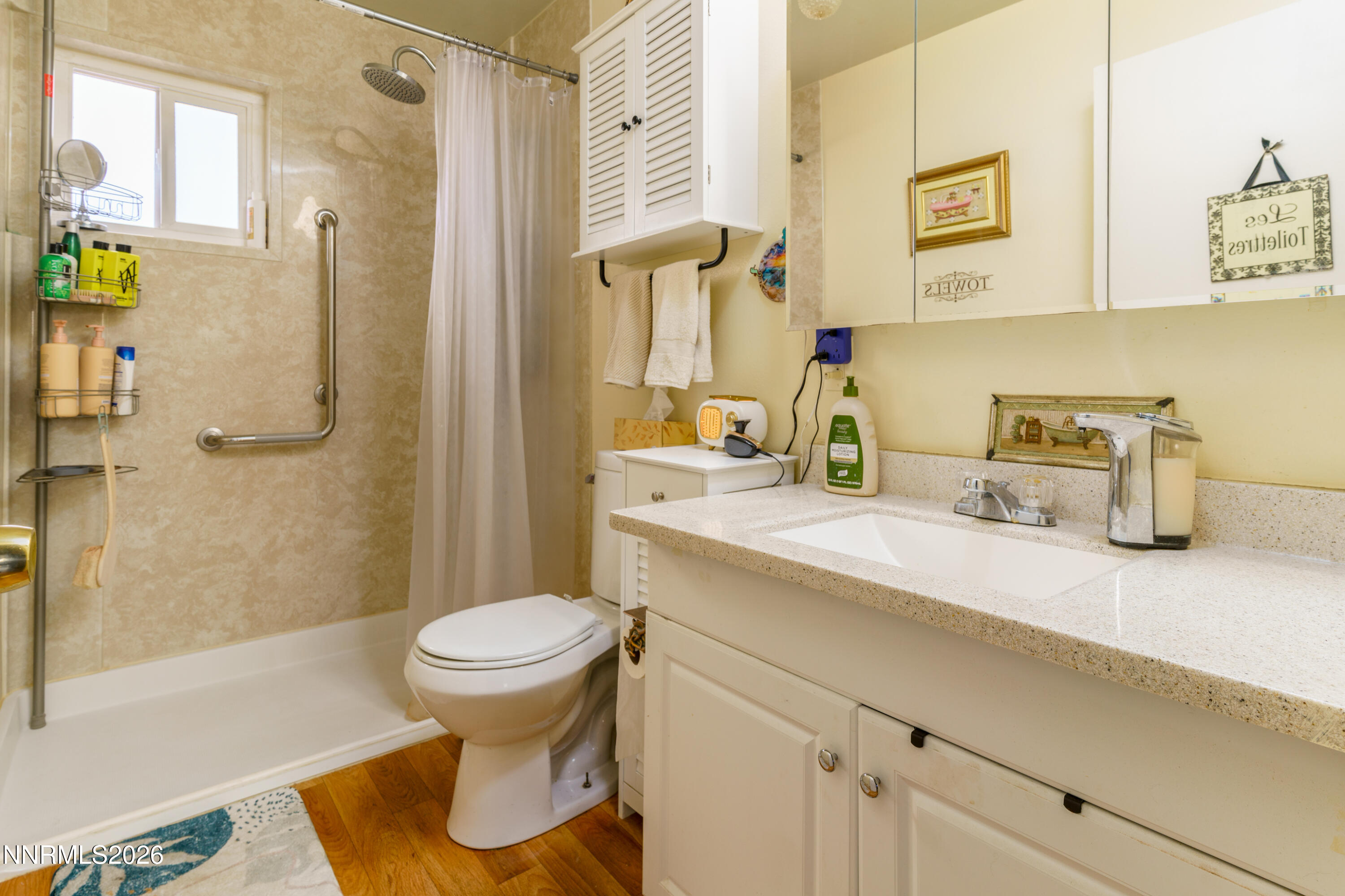 595 Cora Way Fallon, NV 89406 - Photo 14 of 23 a bathroom with a sink a toilet and shower