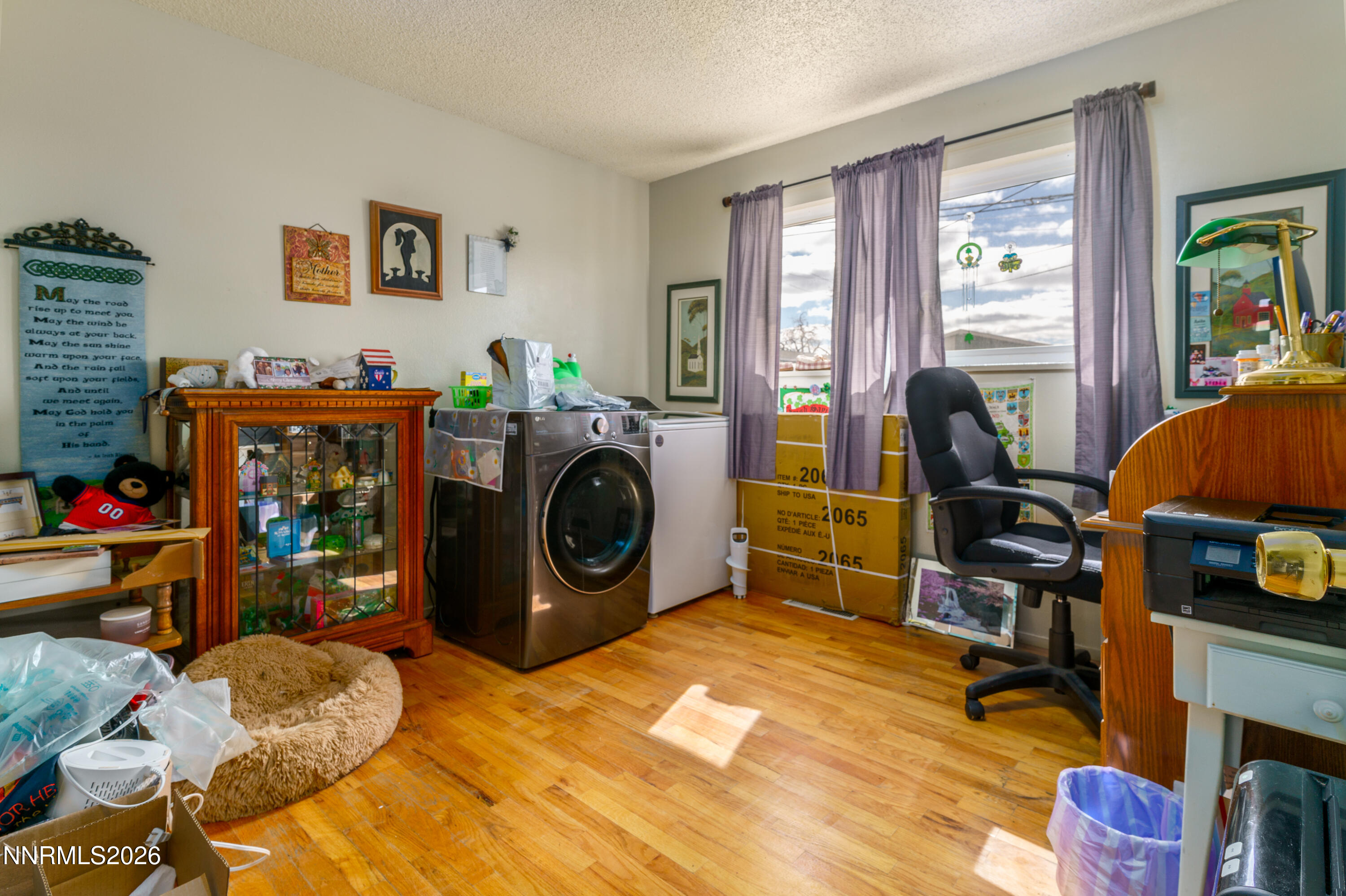 595 Cora Way Fallon, NV 89406 - Photo 17 of 23 a bed room with a bed and a television