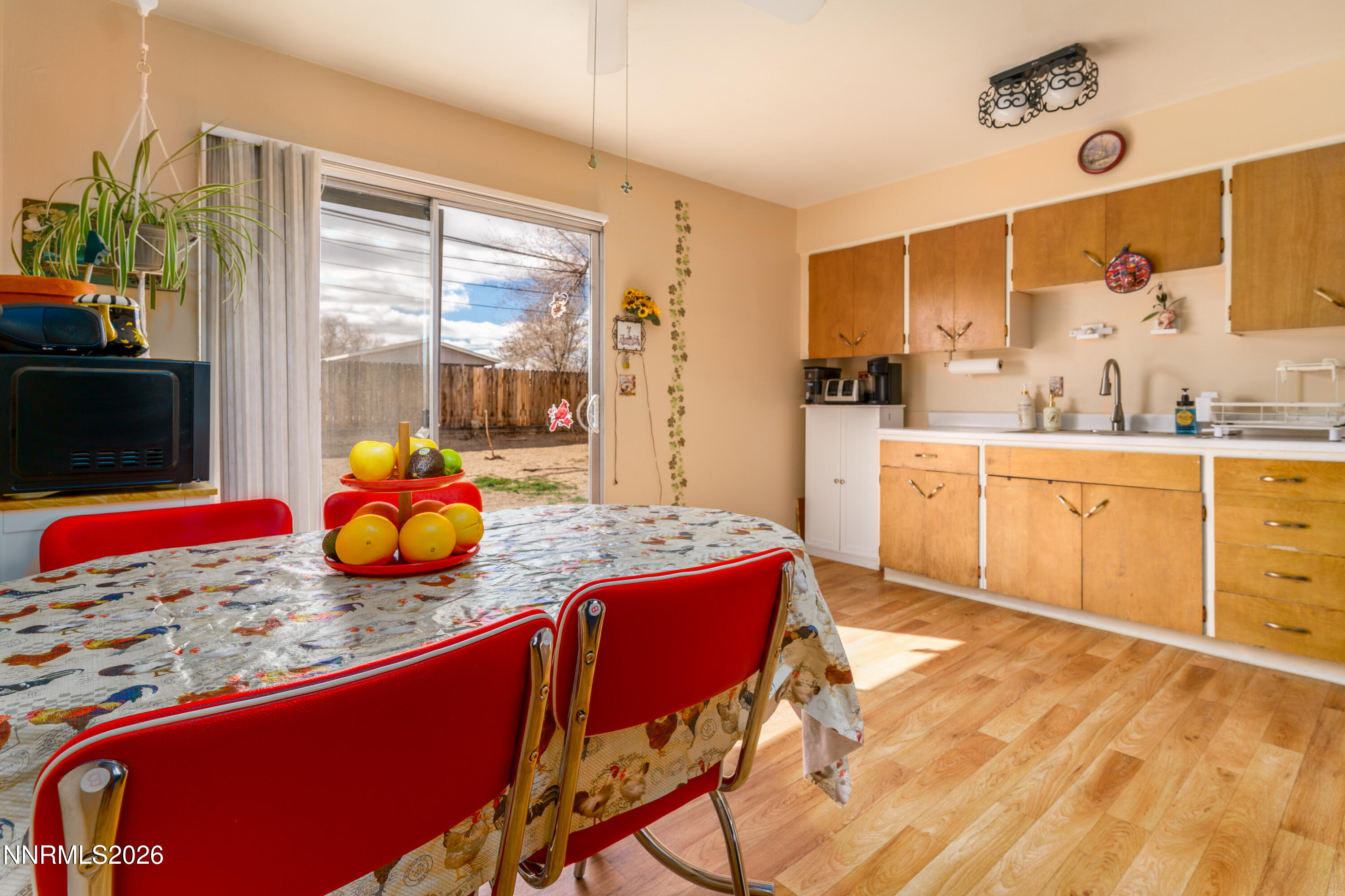 595 Cora Way Fallon, NV 89406 - Photo 9 of 23 a view of a kitchen area with furniture and wooden floor