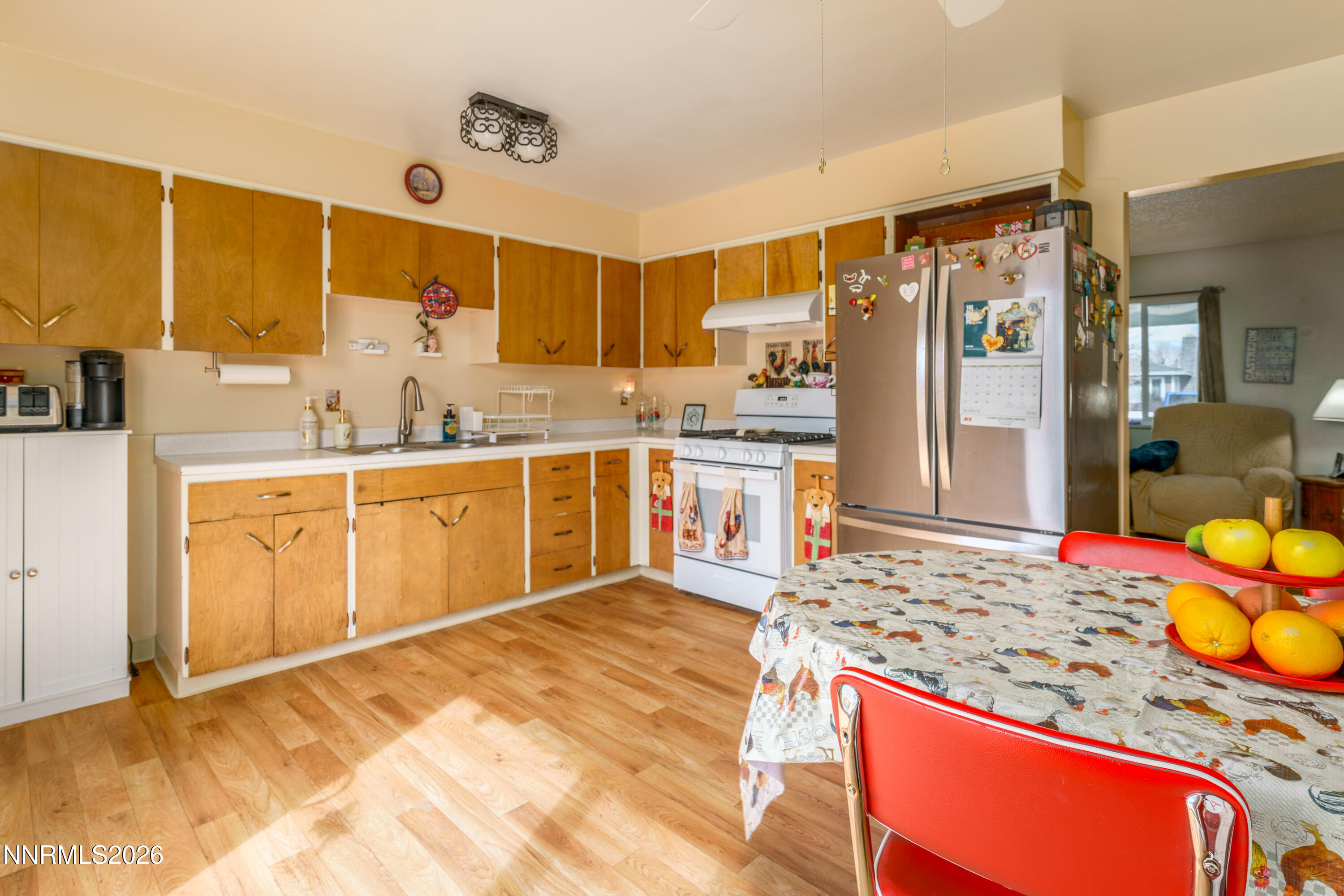 595 Cora Way Fallon, NV 89406 - Photo 10 of 23 a kitchen with stainless steel appliances granite countertop a sink stove and refrigerator