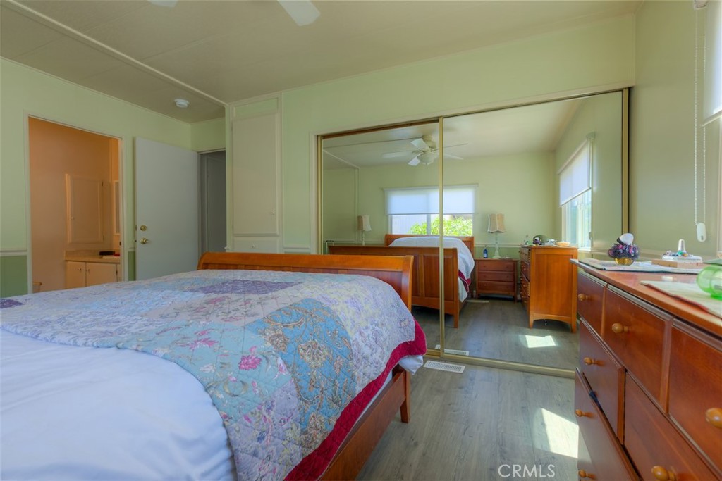 1901 Dayton Road, Unit 133 Chico, CA 95928 - Photo 17 of 36 a bedroom with a bed and a large mirror
