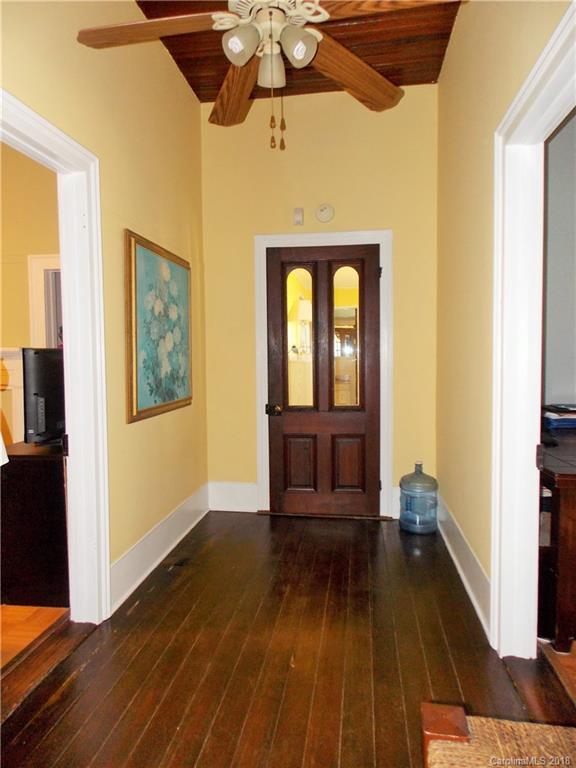 3242 South Potter Road Heath Springs, SC 29058 - Photo 12 of 33 a view of a hallway with wooden floor and staircase