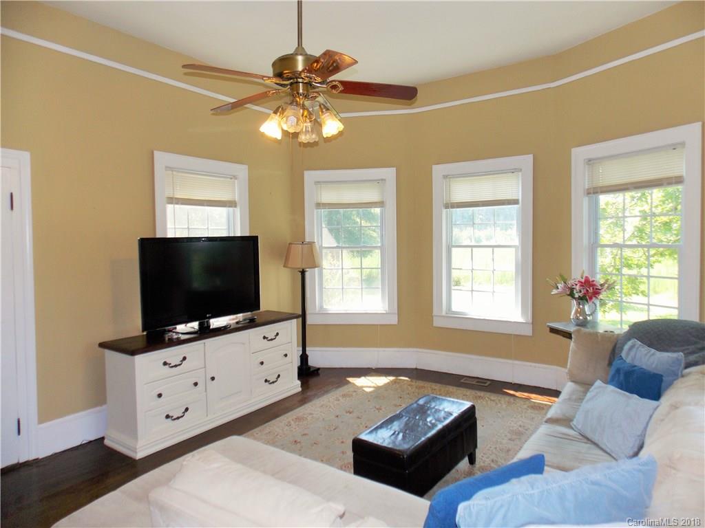 3242 South Potter Road Heath Springs, SC 29058 - Photo 18 of 33 a living room with furniture and a flat screen tv