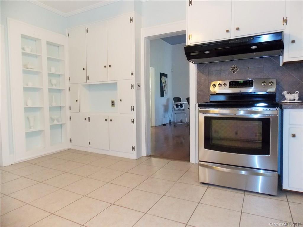3242 South Potter Road Heath Springs, SC 29058 - Photo 20 of 33 a kitchen with granite countertop white cabinets and a stainless steel appliances