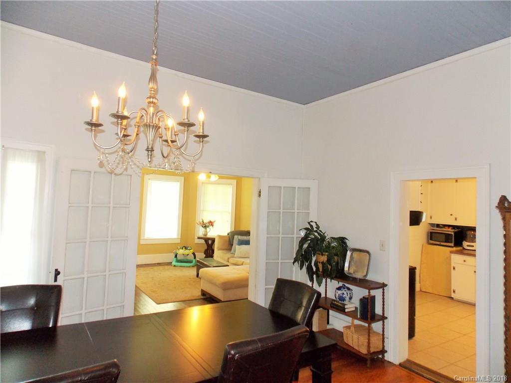 3242 South Potter Road Heath Springs, SC 29058 - Photo 21 of 33 a view of a dining room with furniture a chandelier and wooden floor