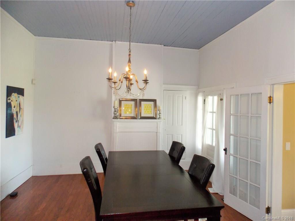 3242 South Potter Road Heath Springs, SC 29058 - Photo 22 of 33 a view of a dining room with furniture and chandelier