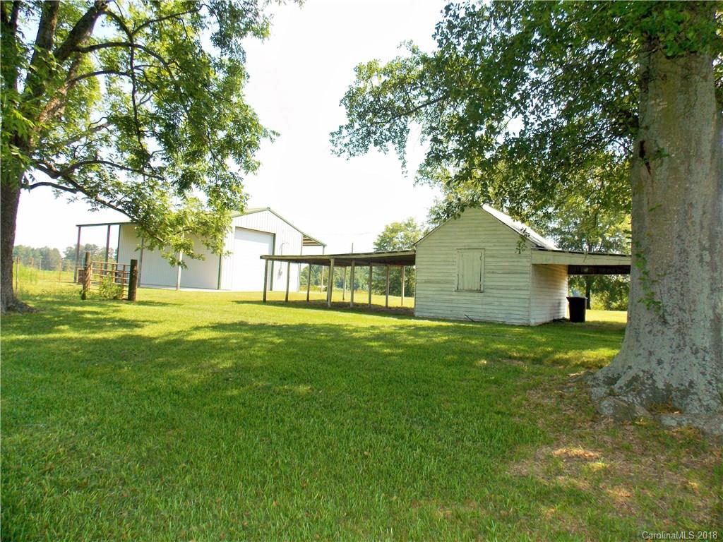 3242 South Potter Road Heath Springs, SC 29058 - Photo 26 of 33 a front view of a house with garden