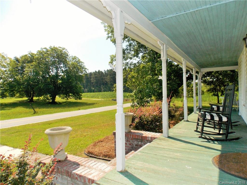 3242 South Potter Road Heath Springs, SC 29058 - Photo 4 of 33 a view of a swimming pool with a porch