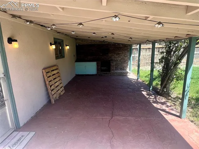 a view of entryway with a garden and stairs
