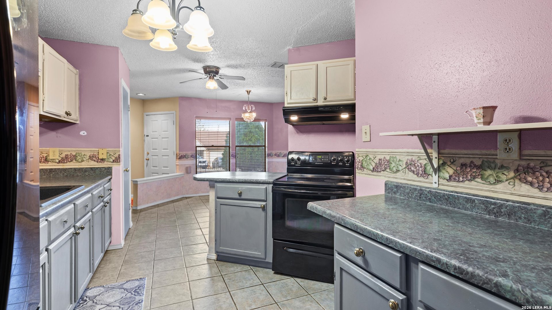 7339 Mystery Ridge Drive Converse, TX 78109 - Photo 13 of 23 a kitchen with a stove and a sink