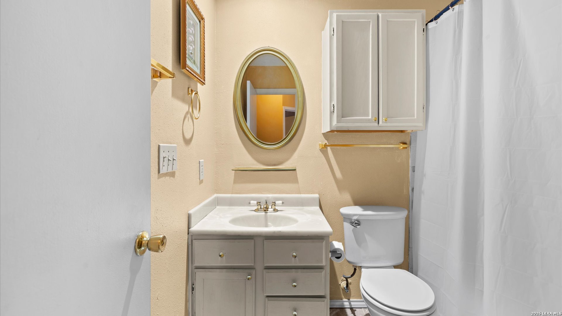 7339 Mystery Ridge Drive Converse, TX 78109 - Photo 15 of 23 a bathroom with a sink and a mirror