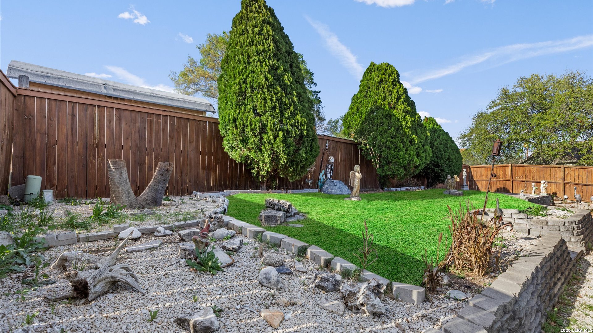 7339 Mystery Ridge Drive Converse, TX 78109 - Photo 19 of 23 a backyard of a house with lots of green space