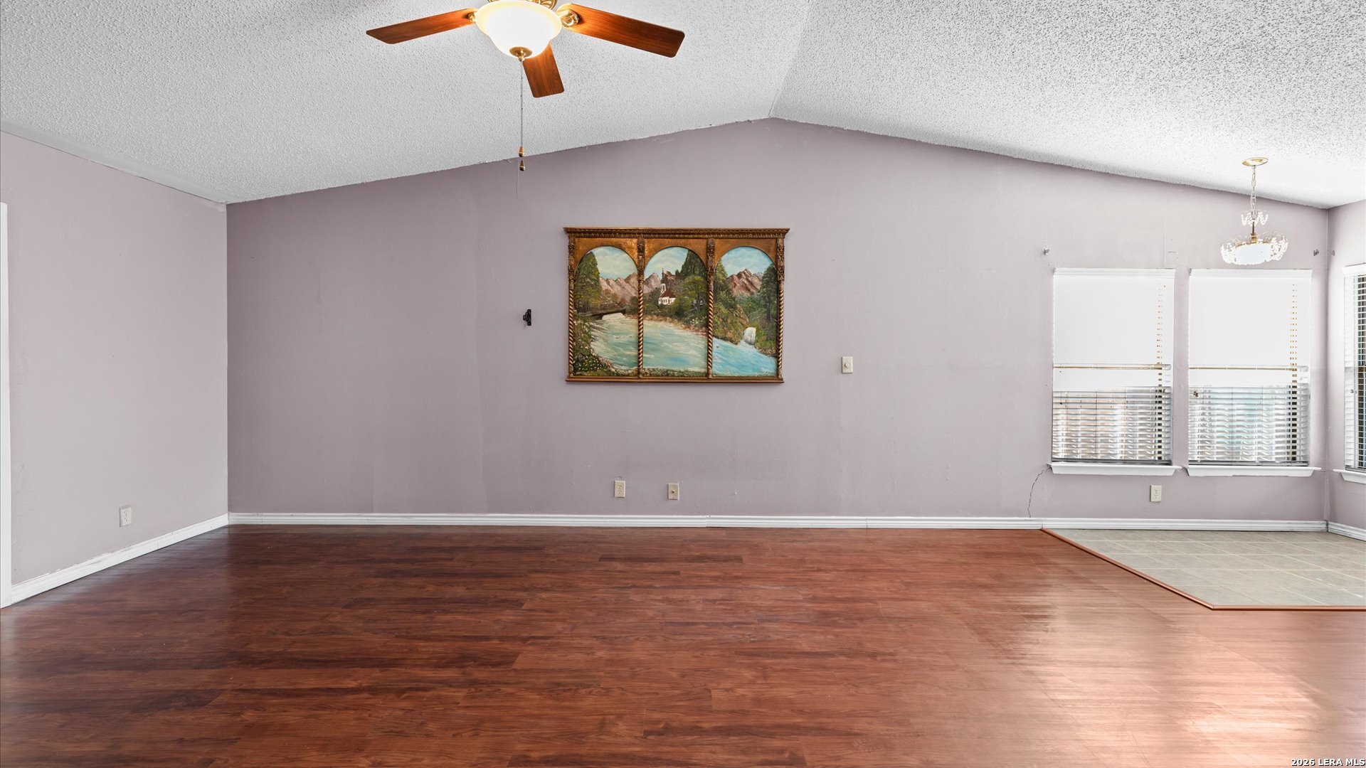 7339 Mystery Ridge Drive Converse, TX 78109 - Photo 7 of 23 an empty room with wooden floor and windows