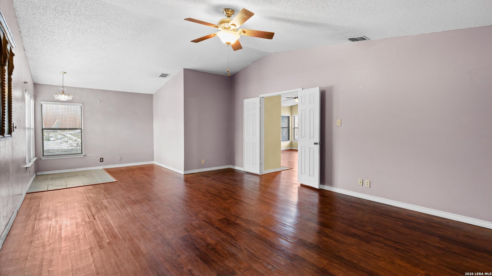 7339 Mystery Ridge Drive Converse, TX 78109 - Photo 9 of 23 a view of an empty room with window and wooden floor