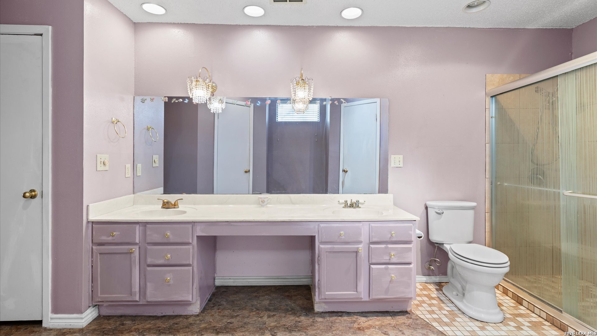 7339 Mystery Ridge Drive Converse, TX 78109 - Photo 10 of 23 a bathroom with a sink a toilet and large mirror