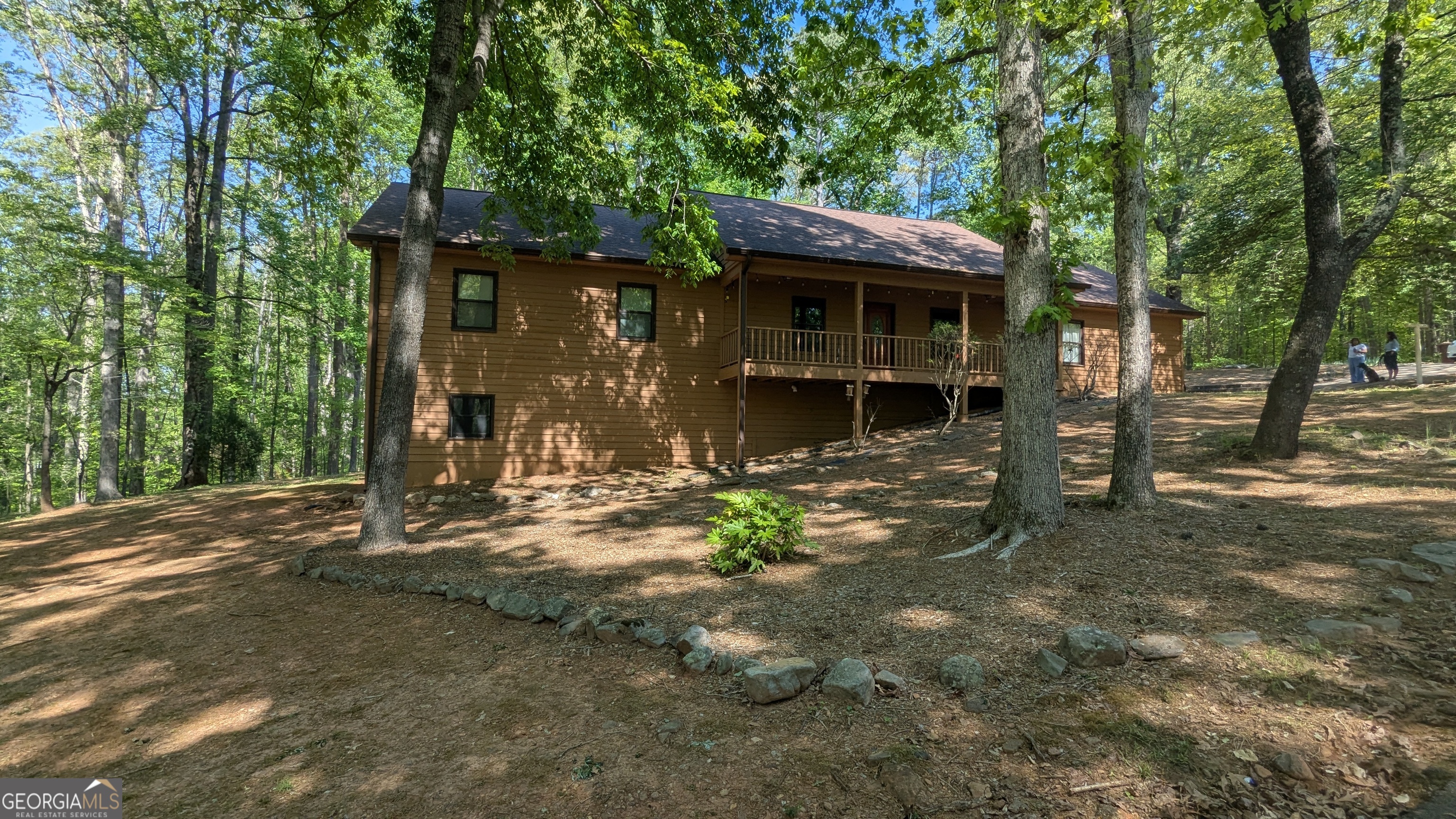 8885 Knoll Drive Gainesville, GA 30506 - Photo 1 of 1 a view of a house with backyard and sitting area