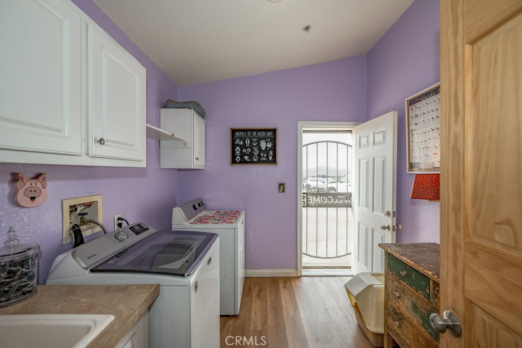 33330 Palen Road Agua Dulce, CA 91390 - Photo 30 of 56 a kitchen with a sink stove and cabinets