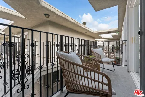 a view of a porch with furniture