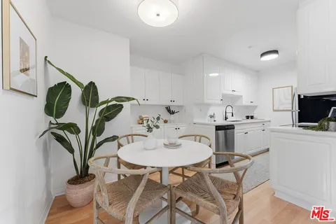 a view of kitchen with dining table and chairs
