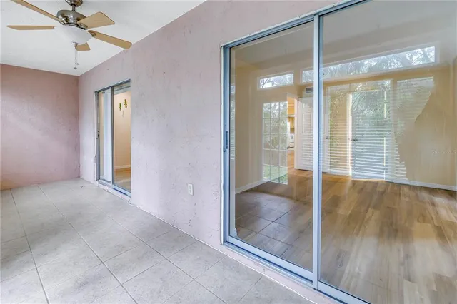 a view of livingroom with a ceiling fan and window