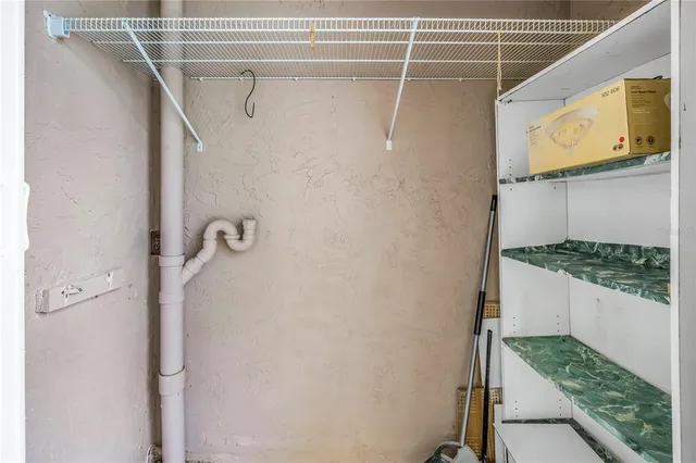a bathroom with a shower and a sink