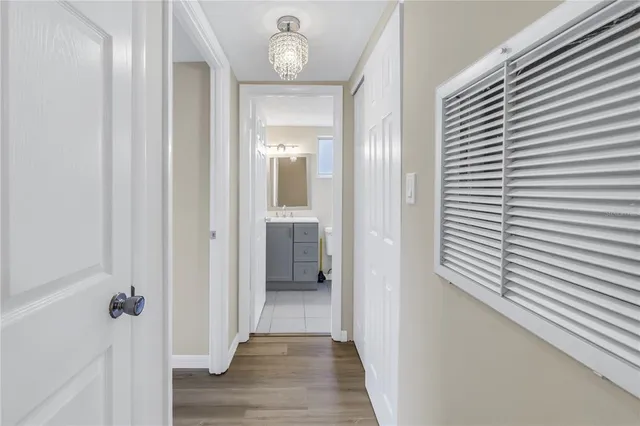 a view of a room with wooden floor